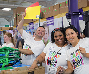 Volunteers Fill Backpacks for Annual Cradles to Crayons Event
